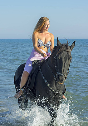 https://traveltopchoice.com/storage/2024/12/pngtree-horsewoman-and-horse-in-the-sea-young-horseback-riding-training-photo-image_23063888.jpg